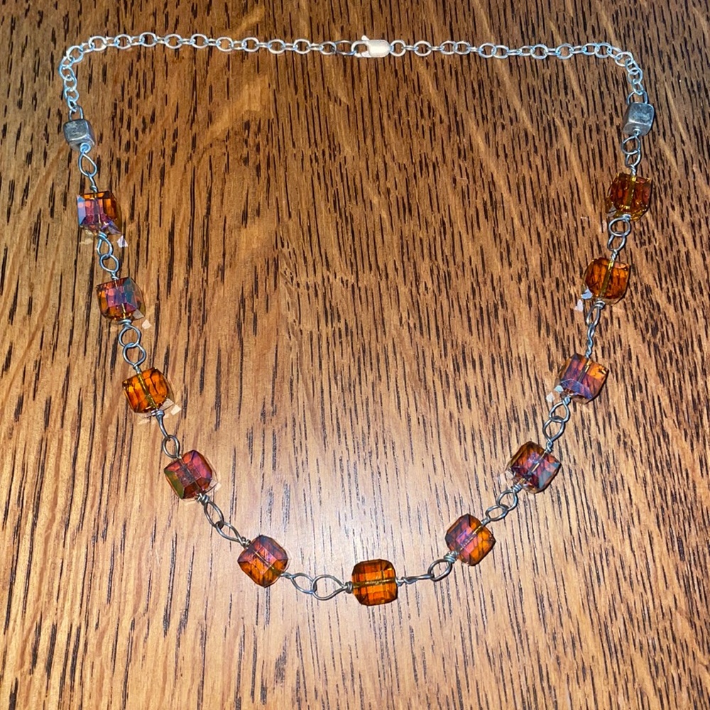 Artist made necklace 11 amber colored glass+ 2 sterling square beads on silver